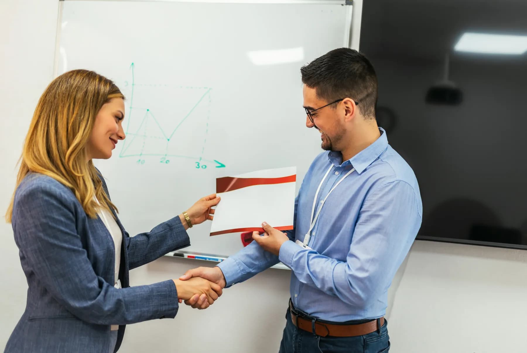 Business partners shaking hands after agreeing a contract