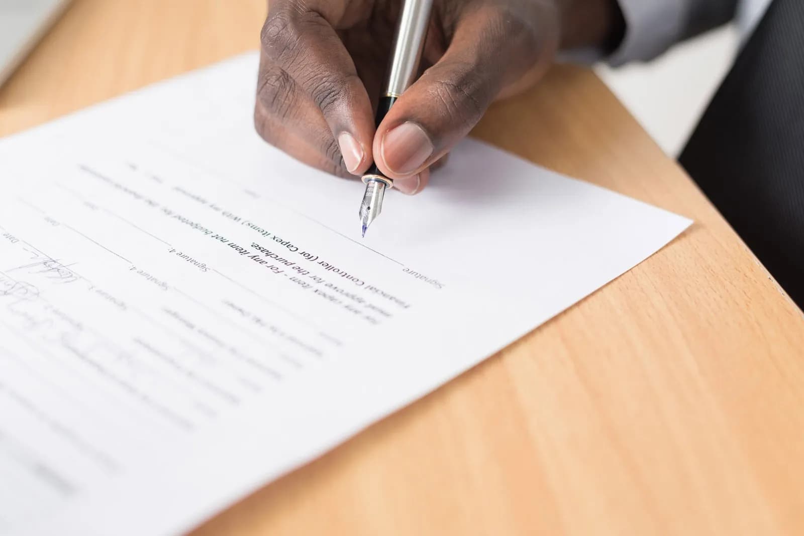Regulatory specialist signing FDA submission documents