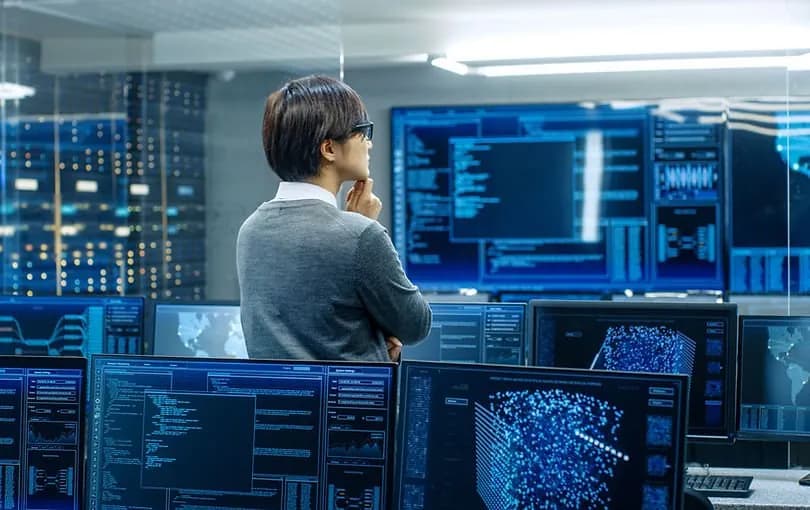 Security operations center team monitoring information security dashboards